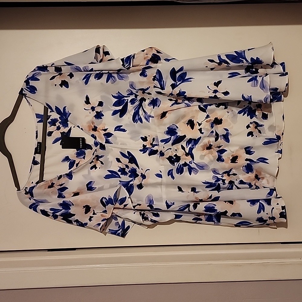 White and blue floral blouse